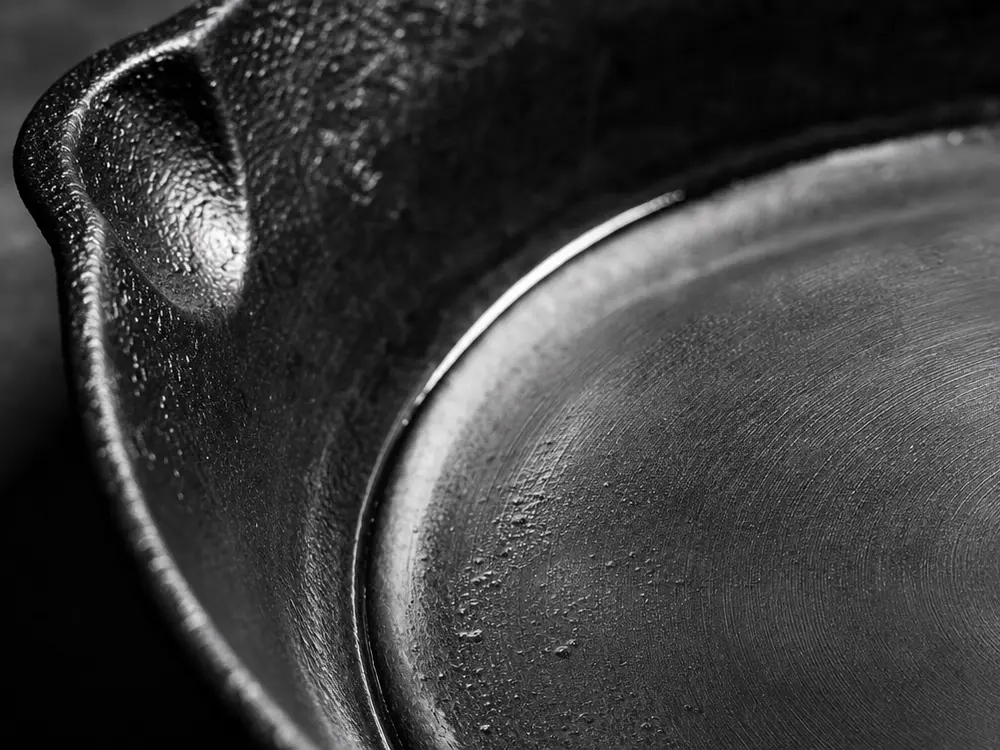 Close-up of cast iron and stainless steel cookware
